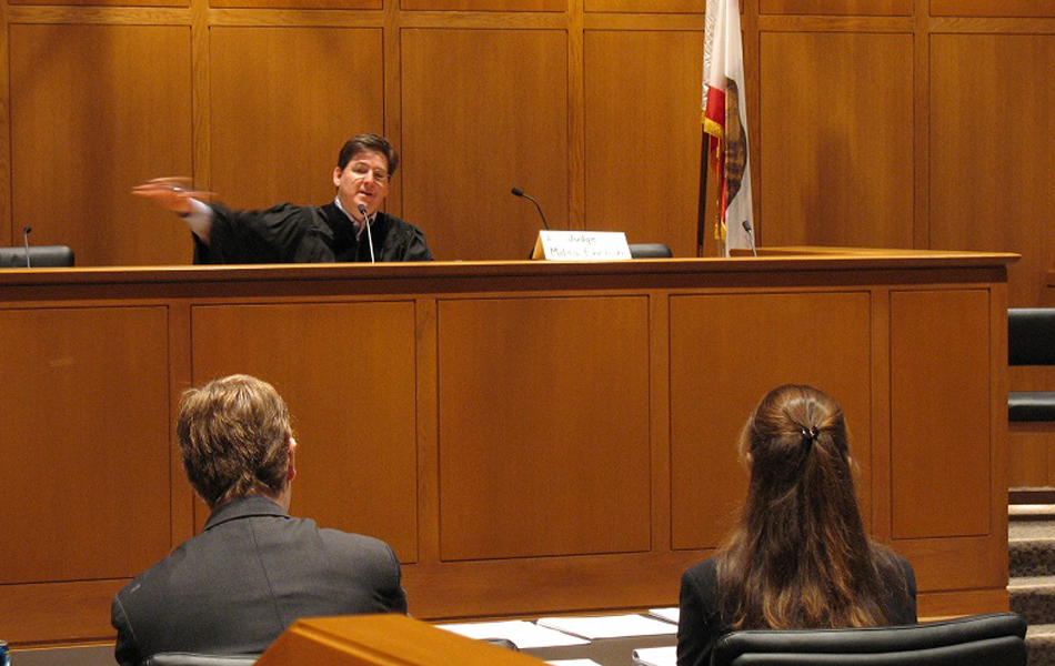 A court room with a judge and lawyers